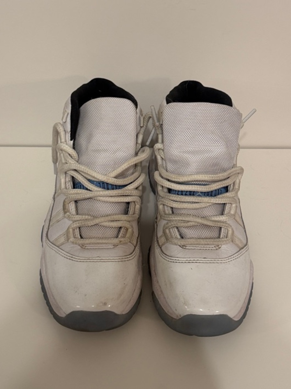Nike White Kids Sneakers with Gray Soles and Blue Tongue Accents